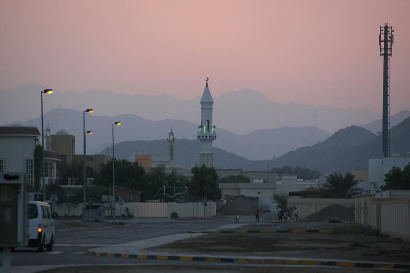 United Arab Emirates -Fujairah- Sept. 26, 2009:

HOUSE & HOME: The sun sets over the main mosque in the Faseel neighborhood of Fujairah on Saturday, Sept. 26, 2009. Amy Leang/The National
 For House & Home neighbourhood / neighborhood column *** Local Caption ***  amy_092609_faseel_07.jpg