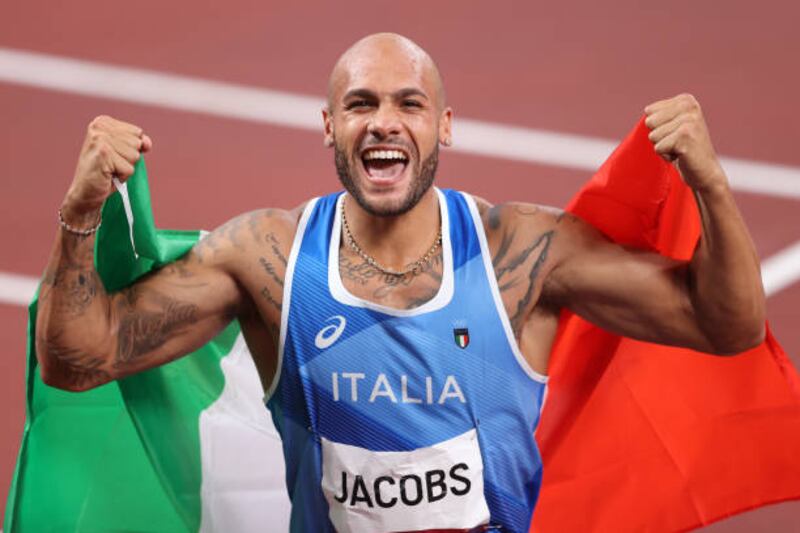Lamont Marcell Jacobs of Italy celebrates after winning the men's 100m gold medal.