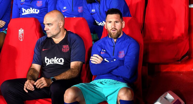 Barcelona's Argentinian striker Lionel Messi sits on the bench. EPA
