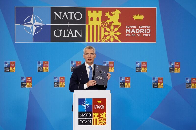 Nato Secretary General Jens Stoltenberg displays the Strategic Concept booklet during his news conference in Madrid. Reuters