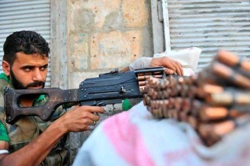 A rebel takes position against Syrian government snipers in the Castal Harami area of  Aleppo. Insurgent ranks have been augmented by rebels from Libya, Saudi Arabia, Pakistan and Bangladesh, as well as Britain, Iraq and the southern Russian republic of Chechnya.