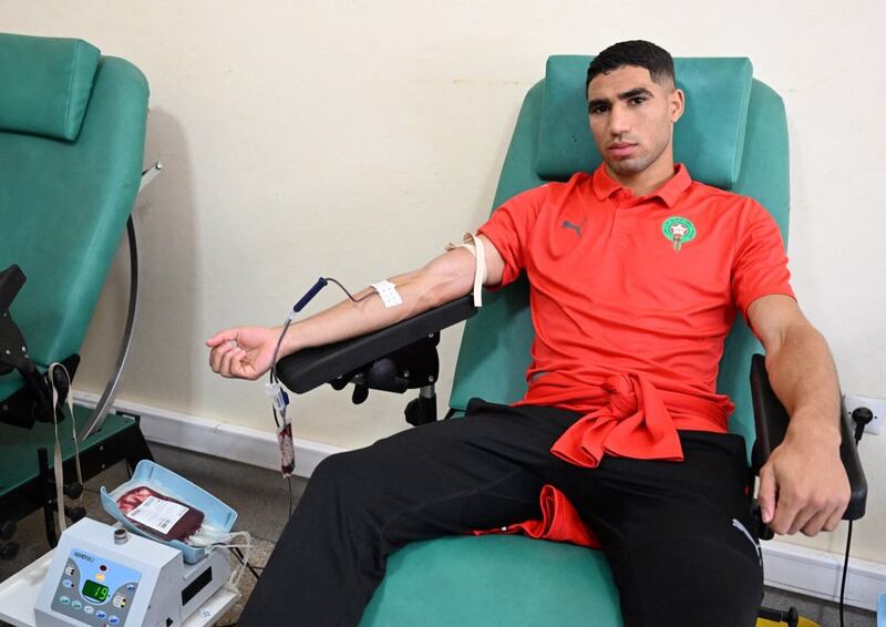 The Morocco football team's star defender Achraf Hakimi donates blood at a clinic in Agadir. AFP