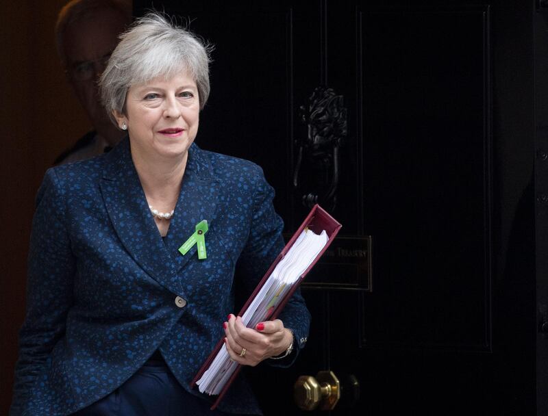 epa07082991 British Prime Minister, Theresa May leaves Downing street, to attend Prime Minister's Questions (PMQs) in the Houses of Parliament, central  London, Britain, 10 October 2018. Media reports state that Theresa May will face British Members of Parliament for the first time since returning from Salzburg where the EU rejected her Brexit plans.  EPA/FACUNDO ARRIZABALAGA