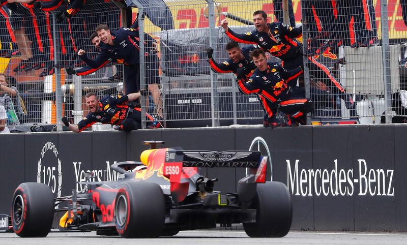 Red Bull mechanics celebrate Verstappen's win. Reuters