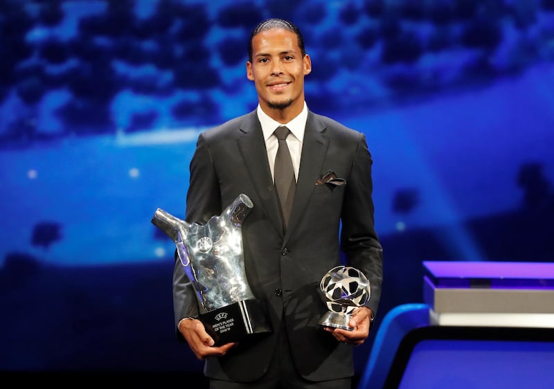 Liverpool's Virgil van Dijk with the Uefa men’s Player of the Year and Champions League Defender of the Season awards. Reuters