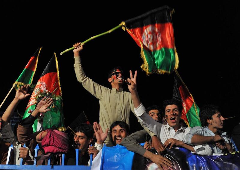 Afghan cricket fans welcome home the national team in Kabul on Saturday after they qualified for the 2015 Cricket World Cup. Noorullah Shirzada / AFP
