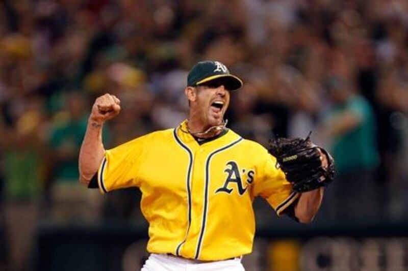 Oakland Athletics relief pitcher Grant Balfour celebrates after the Athletics defeated the Texas Rangers.