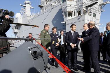 French President Emmanuel Macron attends a drone presentation on the deck of the French warship Dixmude in Toulon. Macron knows his country's place is that of a middle power. Reuters