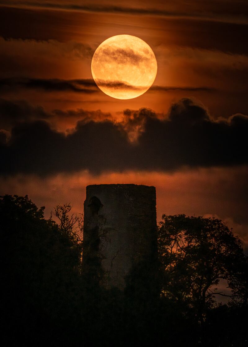 Harvest Moon Over Racton Ruins by Nathan Hill, winner of the Magnificent Moon category. PA