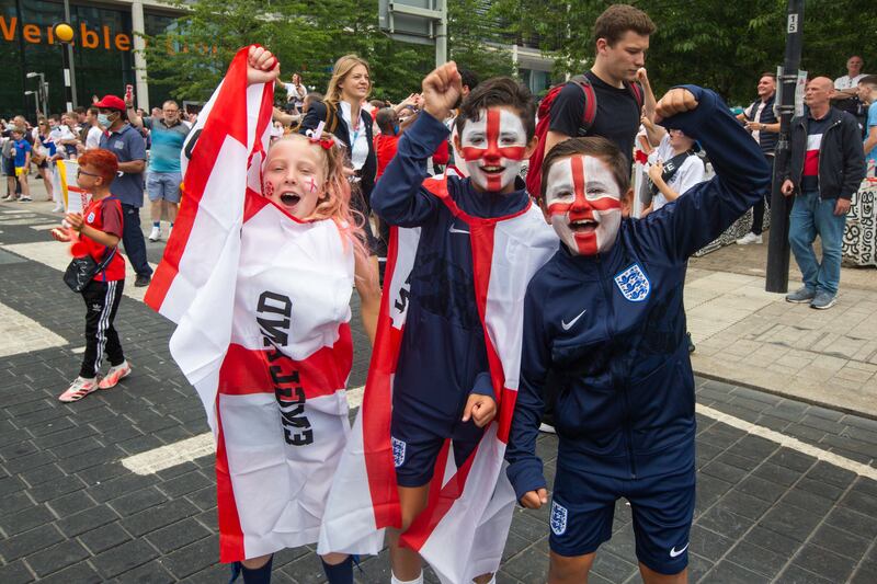 Fans arrive at Wembley stadium ahead of the Euros football final between England and Italy.