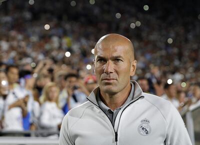 Real Madrid manager Zinedine Zidane walks across the field before the team's International Champions Cup soccer match against the Manchester City Wednesday, July 26, 2017, in Los Angeles. (AP Photo/Jae C. Hong)