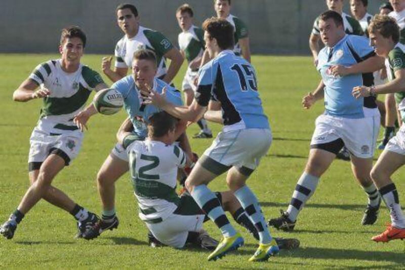 The BSAK boys, in blue, went down to Jumeirah College in the UAE Schools League. Razan Alzayani / The National