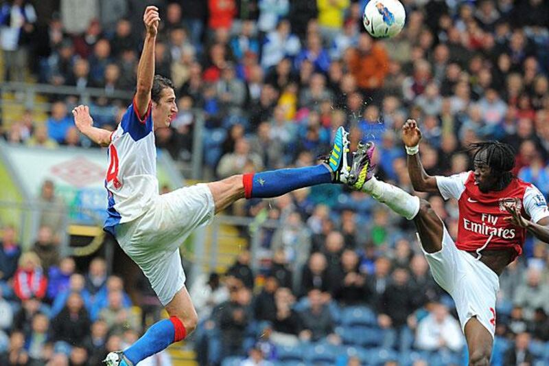 The Blackburn Rovers midfielder Radosav Petrovic, left, clashes boots with Gervinho, the Arsenal forward, during Rovers' 4-3 victory at Ewood Park.

Andrew Yates / AFP