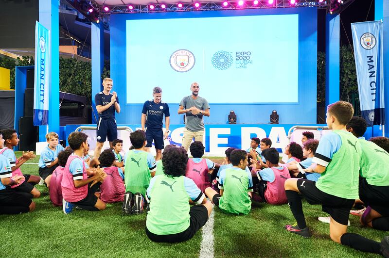 Manchester City manager, Pep Guardiola speaks to young footballers at Expo 2020 Dubai on Monday, November 15, 2021. Photo: Expo 2020 Dubai / City Football Group