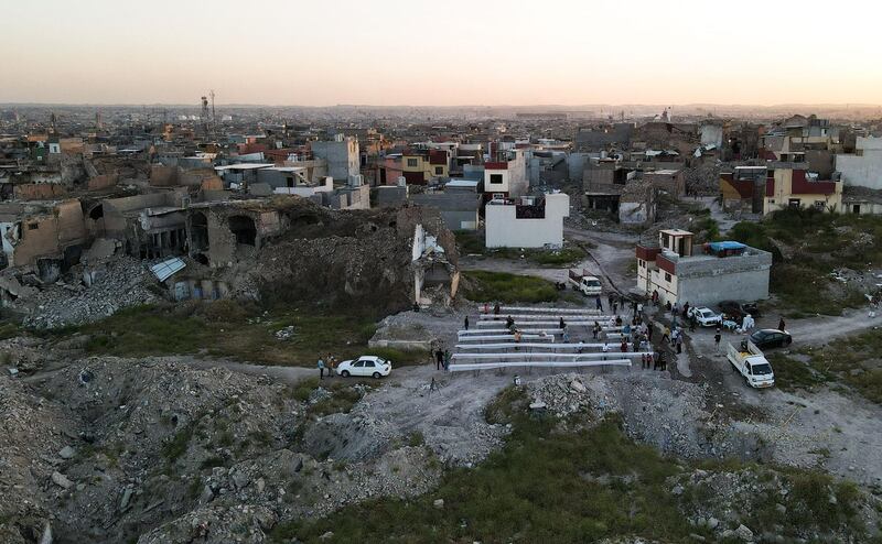 Iraqis set tables before a collective iftar on the second day of Ramadan in the war-ravaged old part of the northern city of Mosul. AFP