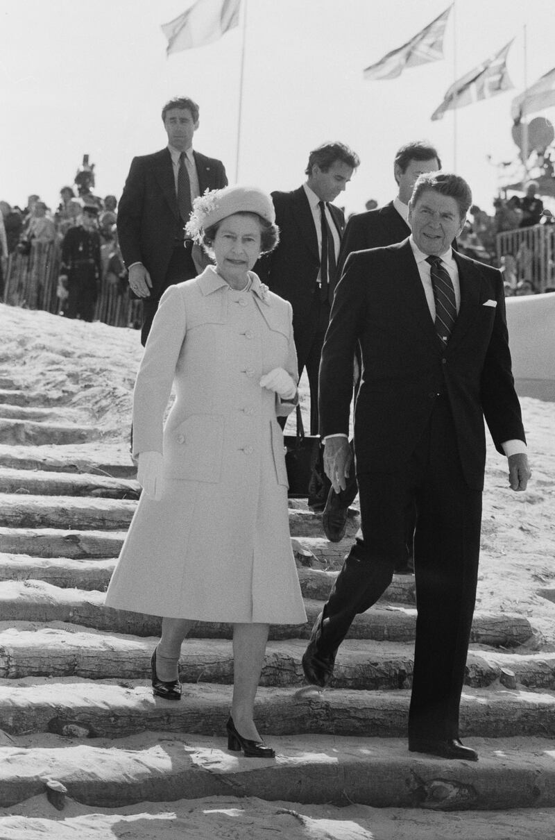 Queen Elizabeth II and American politician and actor Ronald Reagan (1911 - 2004) at Utah Beach to commemorate the 40th anniversary of the D-Day, Normandy, France, 6th June 1984. (Photo by John Downing/Daily Express/Hulton Archive/Getty Images)