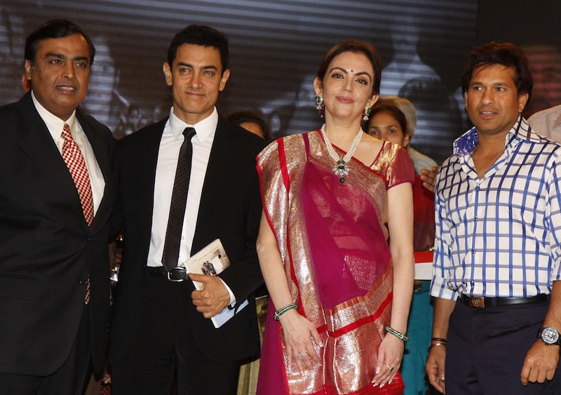 From left, Mukesh Ambani, actor Aamir Khan, Nita Ambani and cricketer Sachin Tendulkar at the Reliance Foundation's Real Heroes Awards ceremony in Mumbai, March 2012. AFP