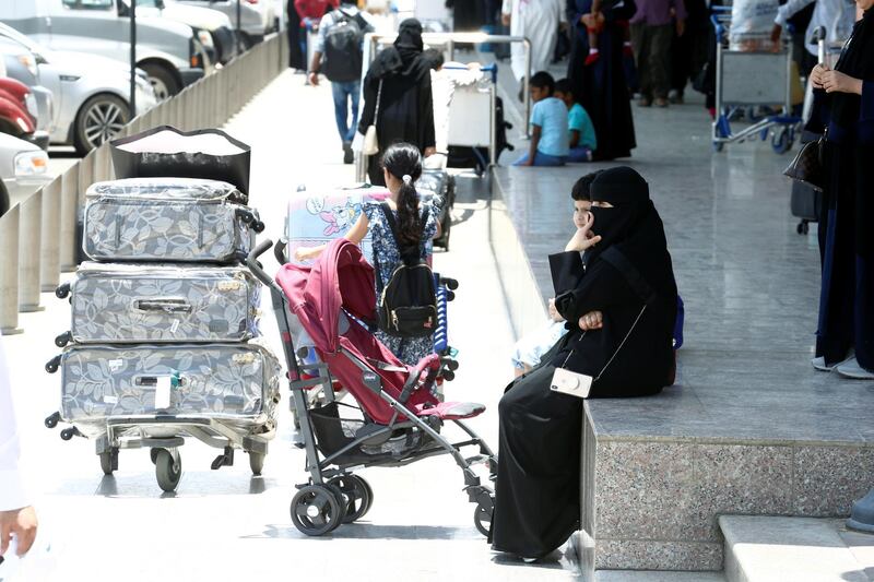 Saudi passengers are seen outside the Saudi Arabia's Abha airport. Reuters