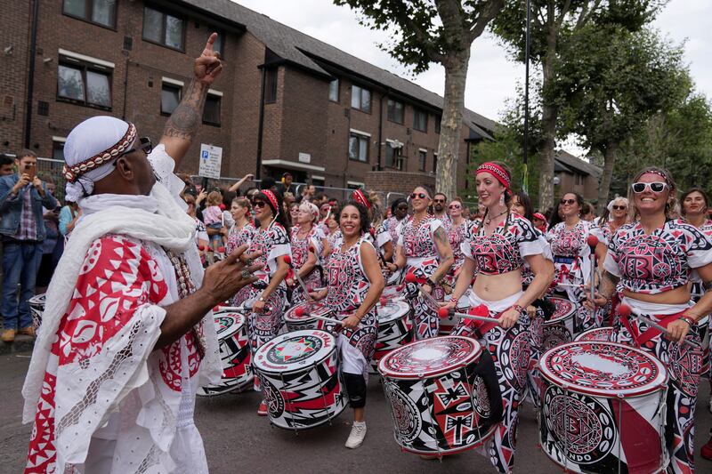 Performers take part in the carnival in London. Reuters