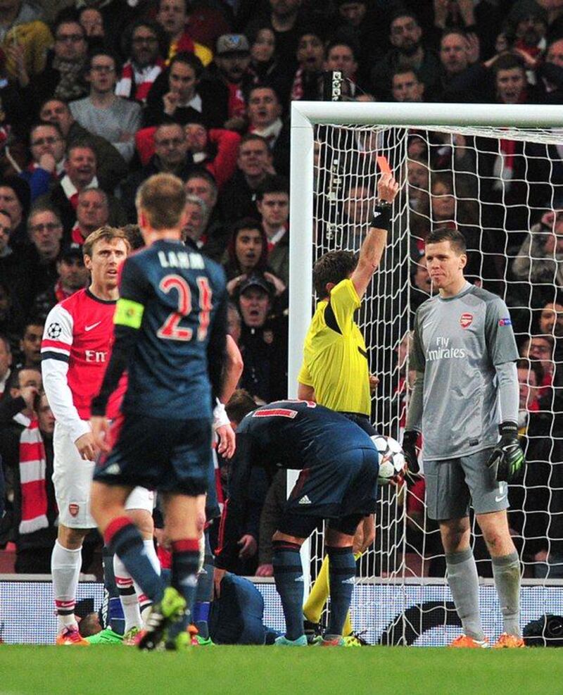 Wojciech Szczesny is given the red card after a foul on Bayern Munich's Arjen Robben on Wednesday night. Glyn Kirk / AFP

