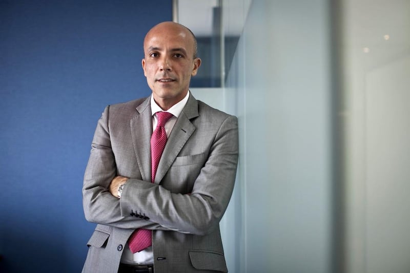 Sherif Salem, portfolio manager at Invest AD, says investor interest in emerging and frontier markets remains positive. Razan Alzayani / The National