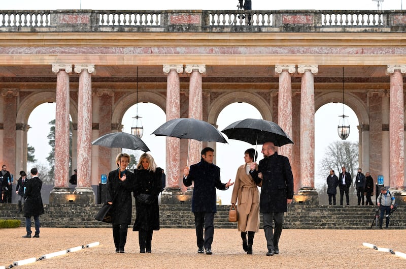 European leaders and their partners arrive at the Grand Trianon estate near the Palace of Versailles, west of Paris. AP