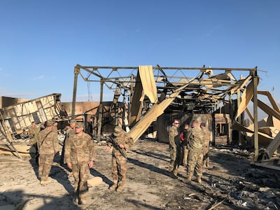 U.S. soldiers inspect the site where an Iranian missile hit at Ain al-Asad air base in Anbar province, Iraq January 13, 2020. REUTERS/John Davison