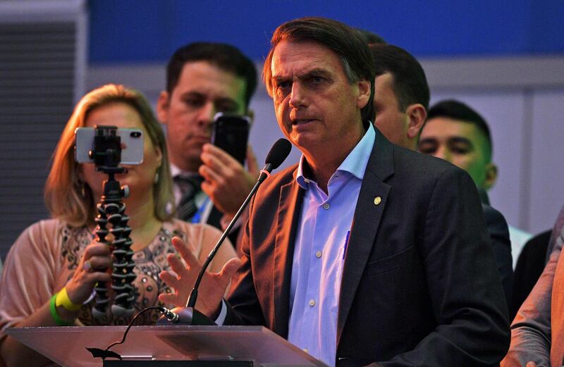 Federal deputy Jair Bolsonaro launches his campaign for the presidency of Brazil for October's national election during the national convention of the Social Liberal Party (PSL), in Rio de Janeiro, Brazil, on July 22, 2018. Controversial extreme-right candidate Jair Bolsonaro is expected to formalize his candidacy on Sunday and officially become the PSL candidate for the presidential election, boosted by strong social media support and polls that show him headed to a second round. / AFP / Carl DE SOUZA
