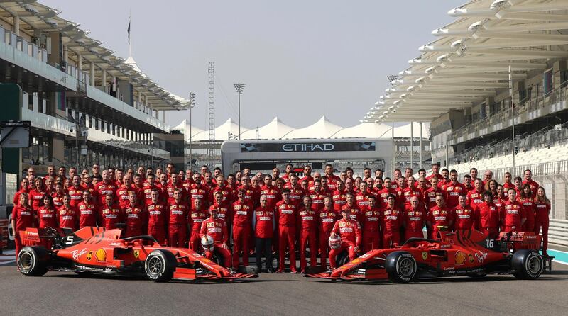 Ferrari drivers Sebastian Vettel of Germany, left, and Charles Leclerc pose for an end season team picture on saturday. AP