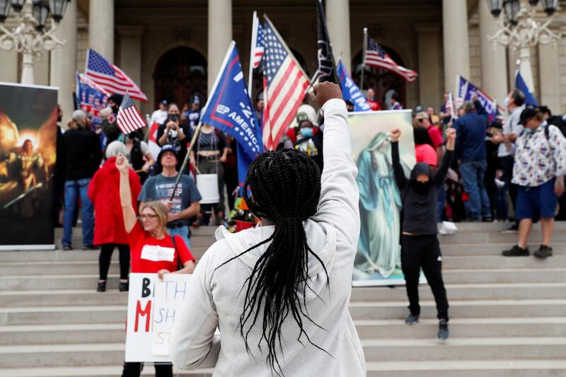 Protesters rally outside the State Capitol building after Joe Biden was declared the winner of the 2020 US presidential election, in Lansing, Michigan.  Reuters