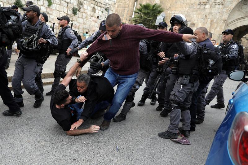 Israeli police officers scuffle with Palestinian protestors outside the Lions gate to Jerusalem's Old City March 12, 2019. REUTERS/Ammar Awad