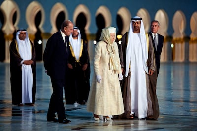 Queen Elizabeth II and her husband Prince Philip, the Duke of Edinburgh, arrive at Sheikh Zayed Grand Mosque with Sheikh Mohamed bin Zayed, Crown Prince of Abu Dhabi at the time, and Prince Andrew, the Duke of York, in November  2010. Andrew Henderson / The National