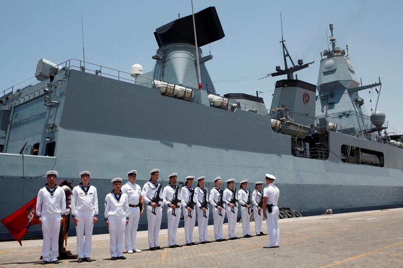 FILE PHOTO: German Navy armed personnel stand in front of the Frigate Hamburg, docked at Port Rashid, in Dubai May 26, 2013. REUTERS/Ahmed Jadallah/File Photo