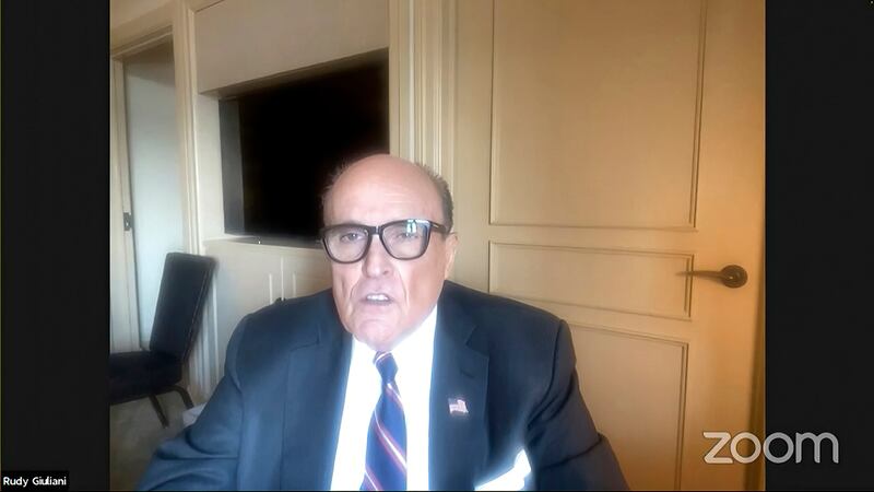 Rudy Giuliani speaks with the House select committee. House select committee /  AP