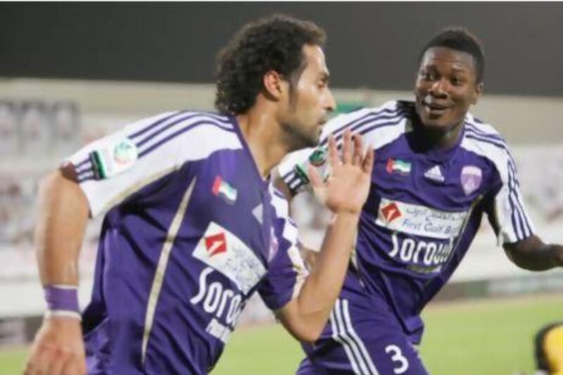 Yasser Al Qahtani, left, and Asamoah Gyan celebrate for Al Ain last season. Al Qahtani returned to Al Hilal at the end of the campaign. Mike Young / The National