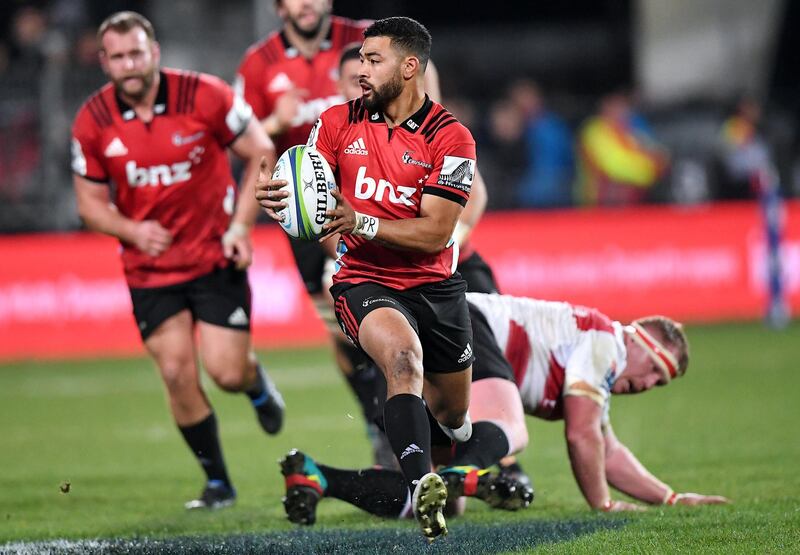 Rugby Union - Super Rugby Final - Crusaders vs Lions - AMI Stadium, Christchurch, New Zealand - August 4, 2018 - Richie Mo’unga of the Canterbury Crusaders avoids a tackle from Jaques Van Rooyen of South Africa's Lions.    REUTERS/Stringer