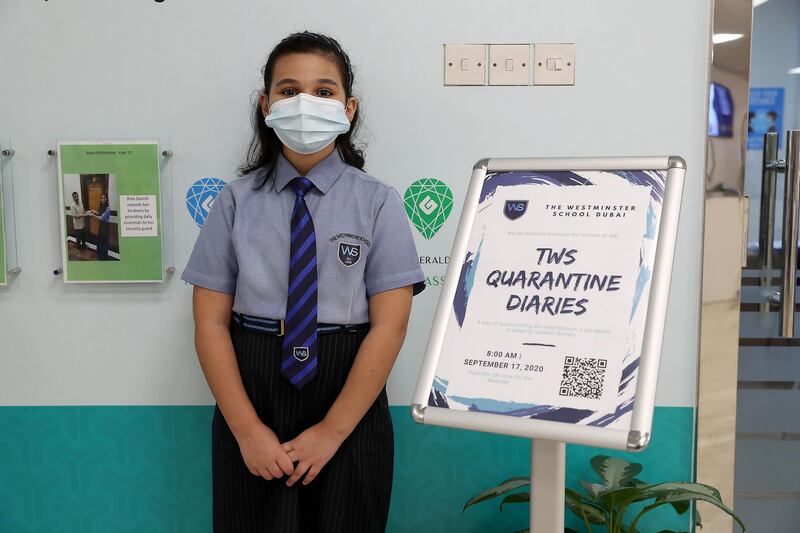 DUBAI, UNITED ARAB EMIRATES , September 21 – 2020 :- Noor Nader student of grade 6 with the Digital Quarantine Diaries ( on the right) of 400 pages which is written by the students of The Westminster School in Al Qusais in Dubai.  (Pawan Singh / The National) For News. Story by Sarwat