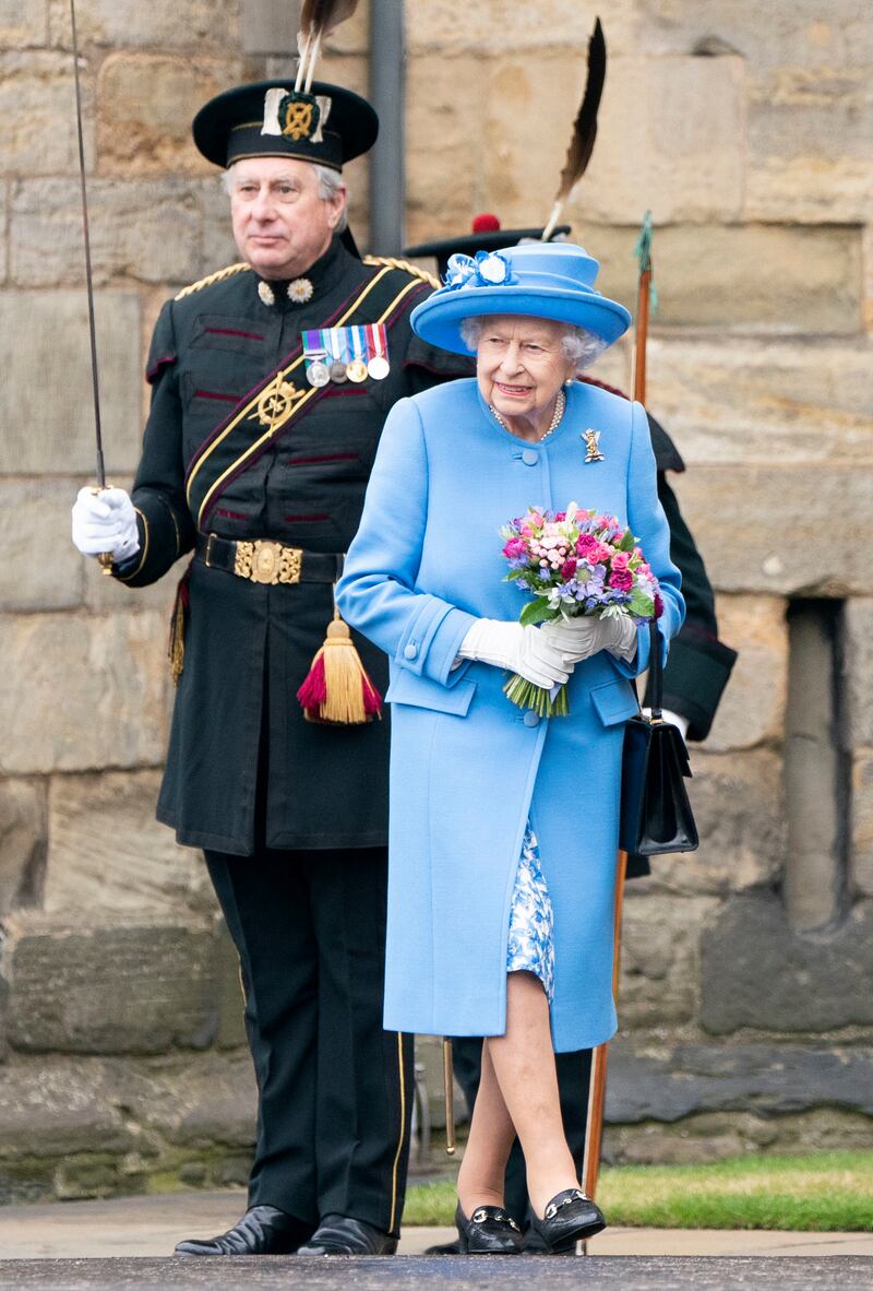 Queen Elizabeth II, in blue, attends the Ceremony of the Keys on the forecourt of the Palace of Holyroodhouse in Edinburgh. Getty Images