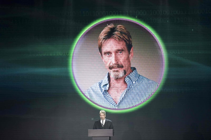 McAfee speaks during the China Internet Security Conference in Beijing, 2016. He was found dead in a prison cell near Barcelona this week. AFP