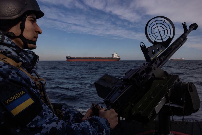 A Ukrainian coast guard on a patrol boat in the Black Sea, as Russia’s war in Ukraine moves towards its third year. Reuters
