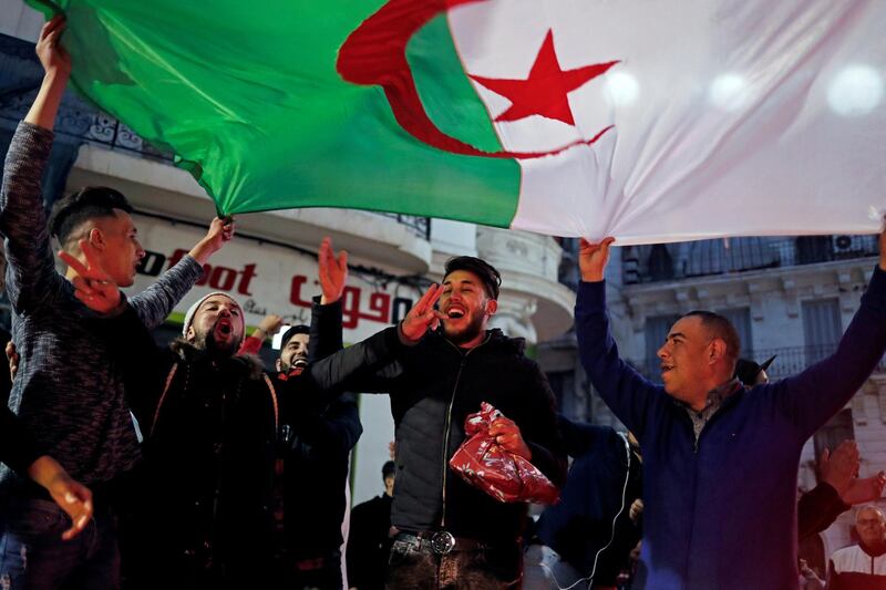 People celebrate on the streets after President Abdelaziz Bouteflika announced he will not run for a fifth term, in Algiers, Algeria March 11, 2019. REUTERS/Zohra Bensemra TPX IMAGES OF THE DAY
