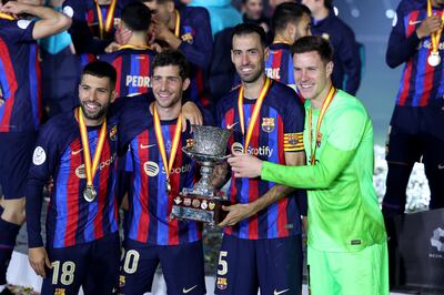 Jordi Alba, Sergi Roberto, Sergio Busquets and Marc Andre ter Stegen of with the Spanish Super Cup after victory over Real Madrid at the King Fahd Stadium in Riyadh on January 15, 2023. Getty
