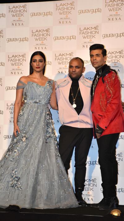 Designer Gaurav Gupta, centre, with Tabu and Karan Johar at Lakme Fashion Week 