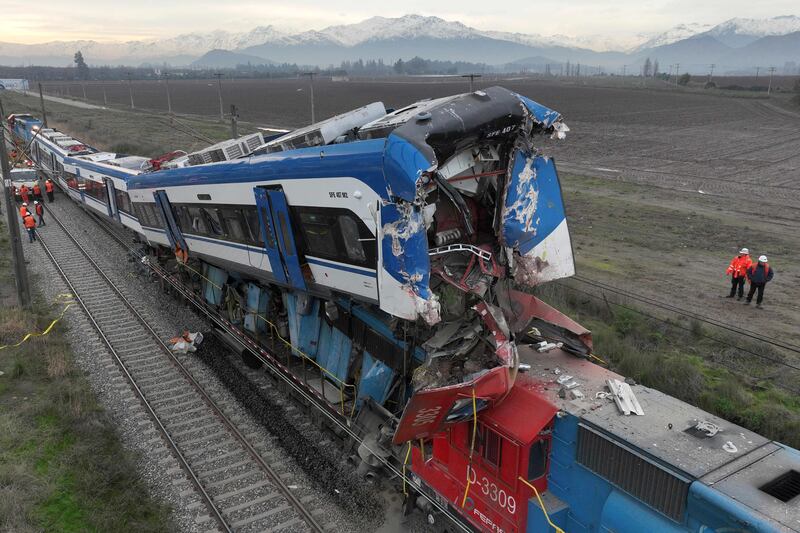 The wreckage of two trains that collided in Santiago, Chile, killing two people and wounding scores. AFP