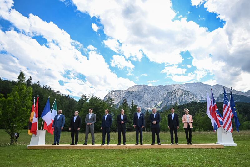 From left, Mr Michel, Mr Draghi, Mr Trudeau, Mr Macron, Mr Scholz, Mr Biden, Mr Johnson, Mr Kishida and Ms von der Leyen at the summit at Elmau Castle. EPA