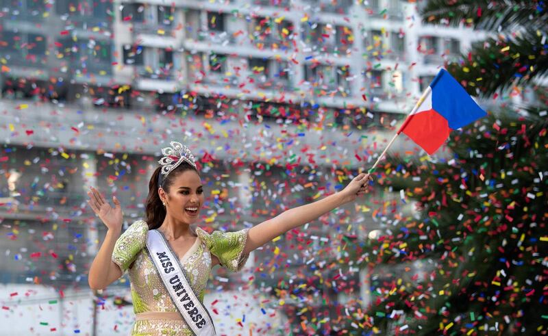 Miss Universe 2018 Catriona Gray of the Philippines waves to fans during a parade held in her honour in Manila on February 21, 2019, two months after she won the crown.  / AFP / Noel CELIS
