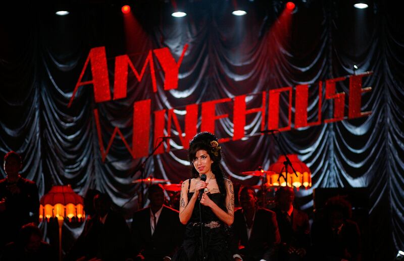 LONDON - FILE:  British singer Amy Winehouse performs at the Riverside Studios for the 50th Grammy Awards ceremony via video link on February 10, 2008 in London, England.  Winehouse has been found dead in her flat in North London on July 23, 2011.  (Photo by Peter Macdiarmid/Getty Images for NARAS) *** Local Caption ***  119660321.jpg