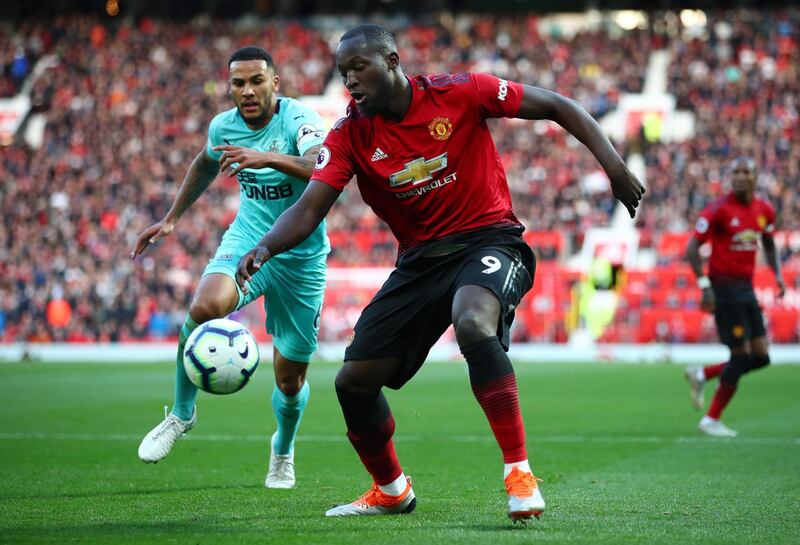 Romelu Lukaku of Manchester United is challenged by Jamaal Lascelles of Newcastle United. Getty Images