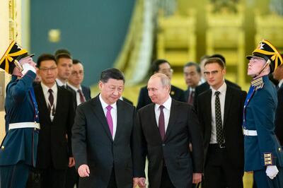 Russian President Vladimir Putin, center right, and Chinese President Xi Jinping, center left, enter a hall for the talks in the Kremlin in Moscow, Russia, Wednesday, June 5, 2019. Chinese President Xi Jinping is on visit to Russia this week and is expected to attend Russia's main economic conference in St. Petersburg. (AP Photo/Alexander Zemlianichenko, Pool)
