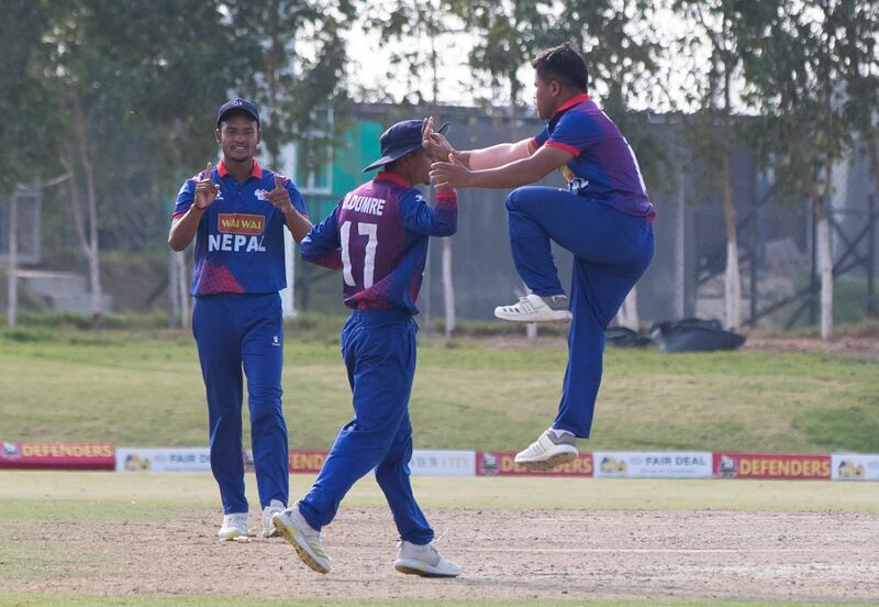 Nepal celebrate a wicket against UAE.